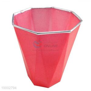 Red plastic trash can