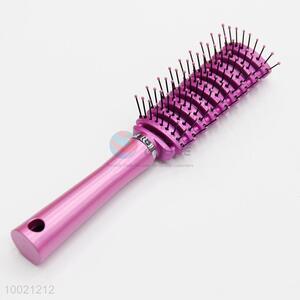 Good quality pink plastic massage comb with wide teeth