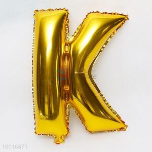Letter K shaped gold foil balloon