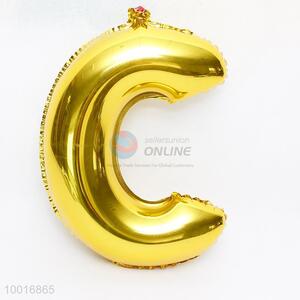 Letter C shaped gold foil balloon