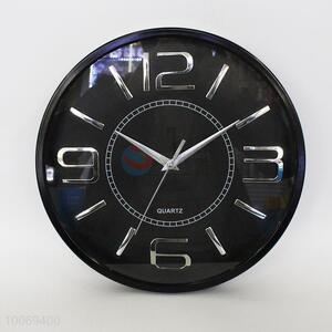 Black round plastic wall clock