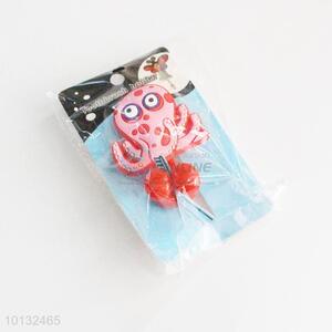 Red octopus shaped toothbrush holder