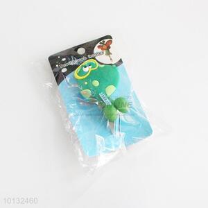 Green dinosaur shaped toothbrush holder