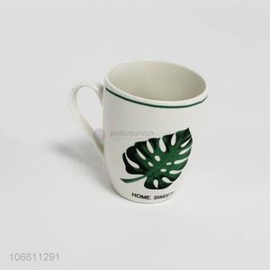 Competitive price green leaf pattern ceramic cup with handle