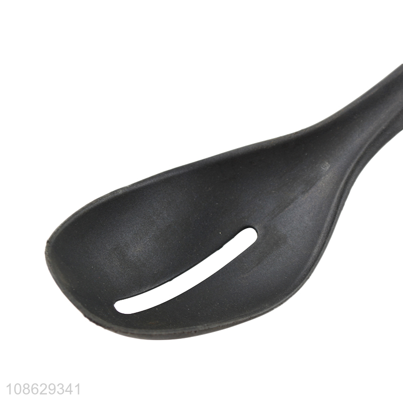 Good quality non-stick slotted basting spoon with wood grain handle